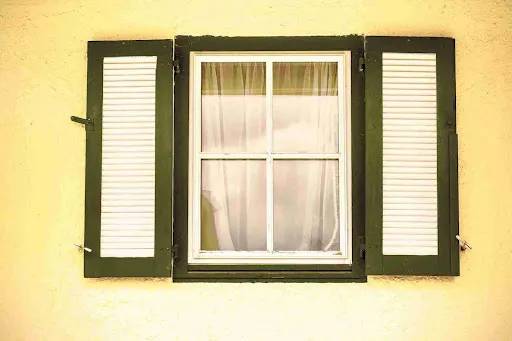 Impact Windows in Pinellas County: What Homeowners Need to Know Large multi-panel window replacement in bright sunroom providing expanded views and enhanced home ventilation.