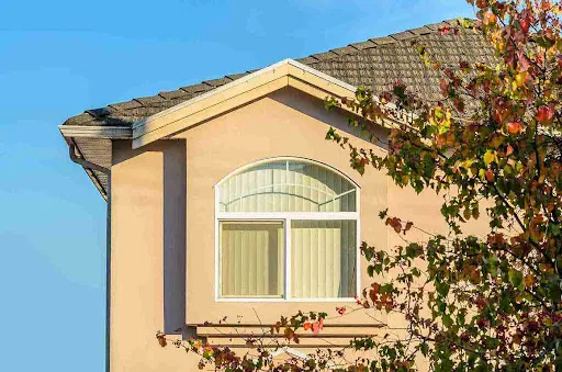 Arched residential window highlighting Hurricane Window Ratings used by Tampa Bay homeowners for storm protection.